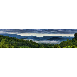 The fog has risen to clouds over the mountain range framed in greenery. Fog and Clouds by Alison Thomas of Serenity Scenes Photography and Digital Art.