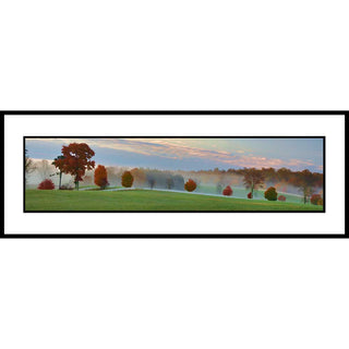 A panoramic landscape print depicting a misty autumn field with green grass, scattered red and orange trees, and a soft pink and blue sky.  Field of Orange by Alison Thomas of Serenity Scenes Photography and Digital Art.