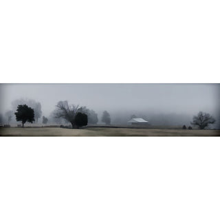 Heavy fog lays like a blanket over a farm. A few dark silhouettes of trees and one small building emerge from the mist, but the distance is nothing but white.  Foggy Day on the Farm by Alison Thomas of Serenity Scenes Photography and Digital Art.