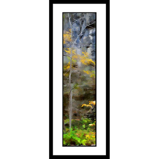 A small tree with yellow leaves growing in front of a rock face. The edges of the leaves blur like watercolors, turning them into smudges of yellow and green against the brown and gray of the rock. Forest Rock by Alison Thomas of Serenity Scenes Photography and Digital Art.
