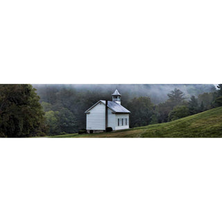 A little white church stands alone in a meadow, nestled in a green forest woven through with fog. Little White Church by Alison Thomas of Serenity Scenes Photography and Digital Art.