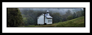 A little white church stands alone in a meadow, nestled in a green forest woven through with fog. Little White Church by Alison Thomas of Serenity Scenes Photography and Digital Art.